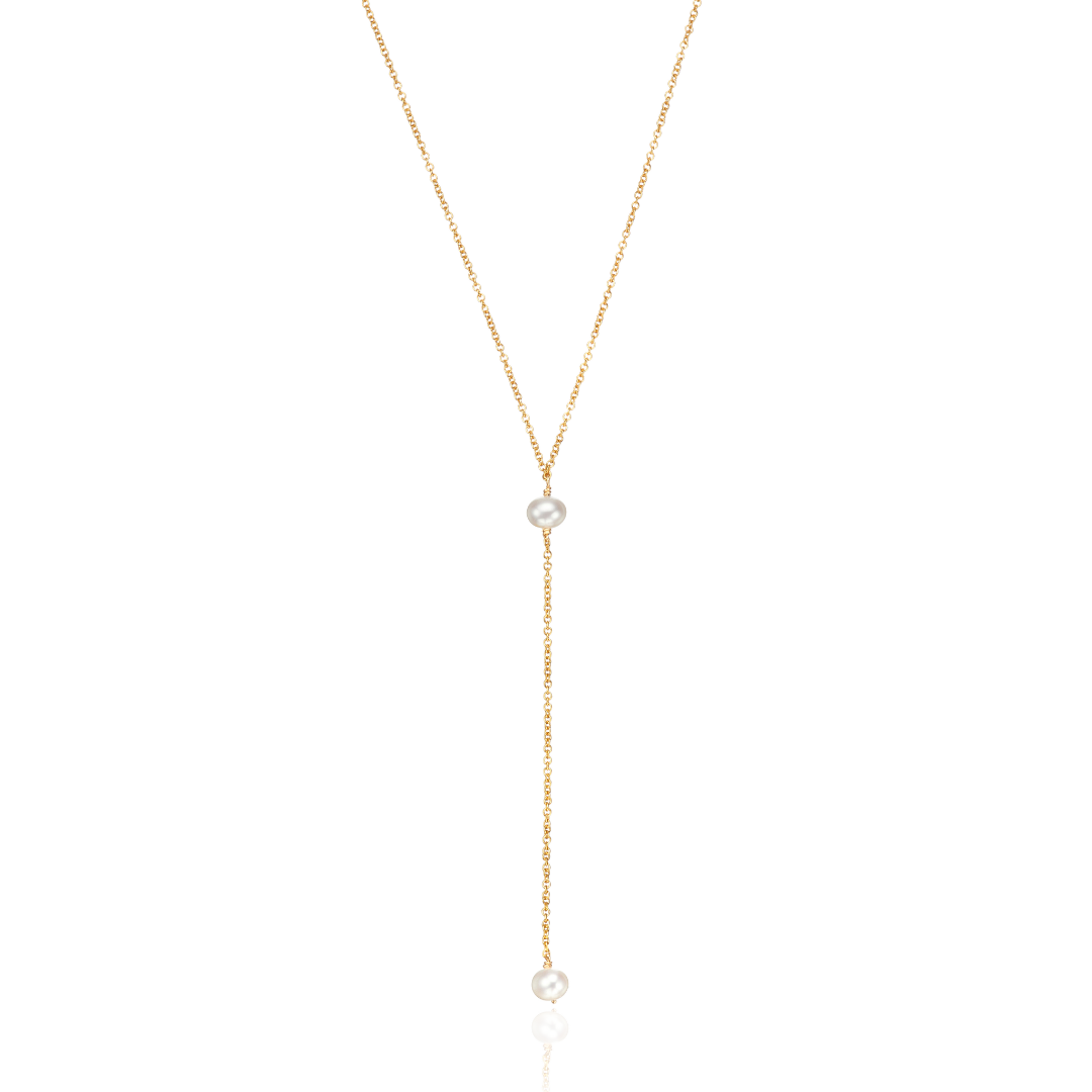 Gold pearl lariat necklace on a white background