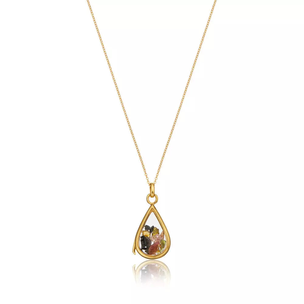 Gold glass gemstone teardrop locket with multiple colours of gemstones on a white background