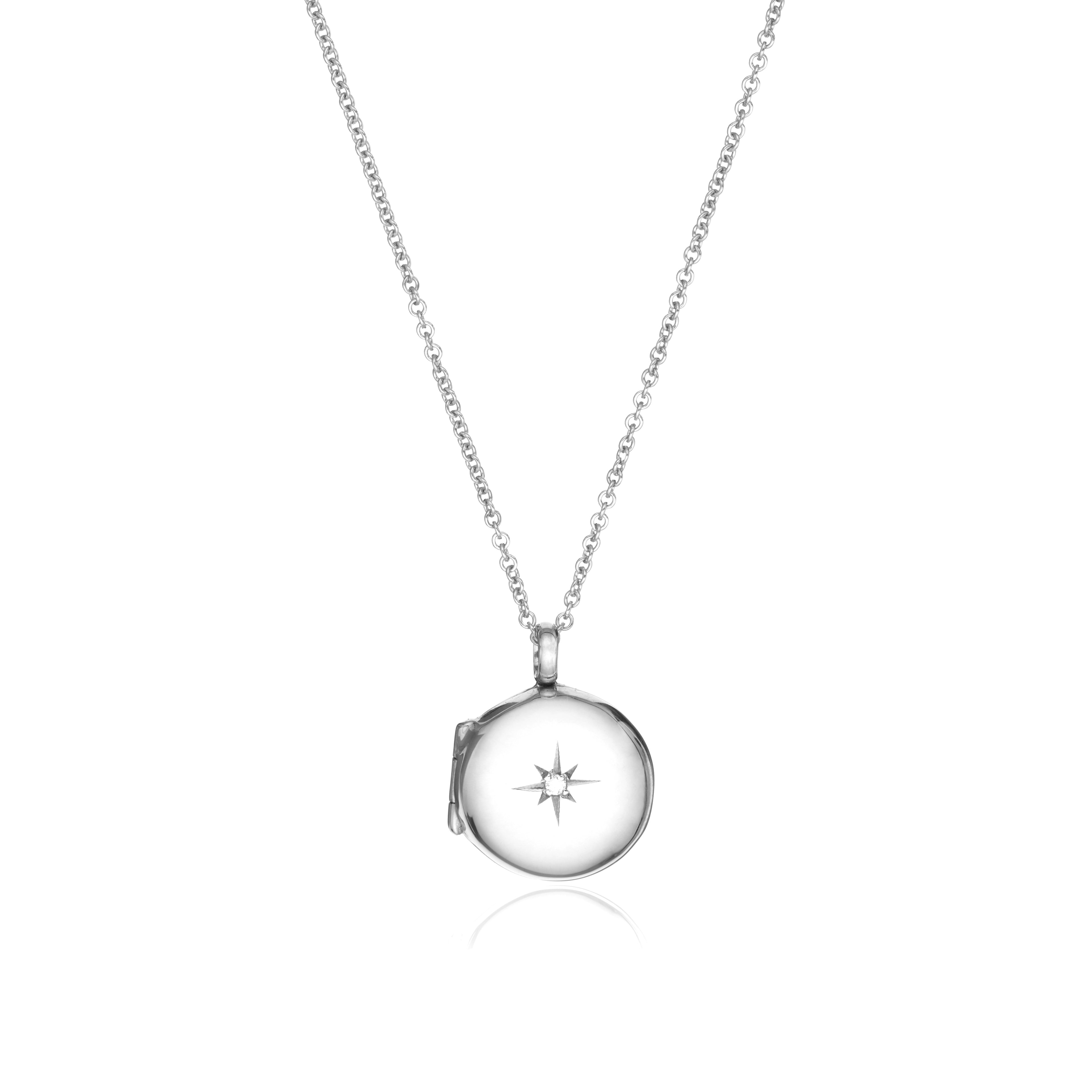 Silver small round diamond locket necklace on a white background