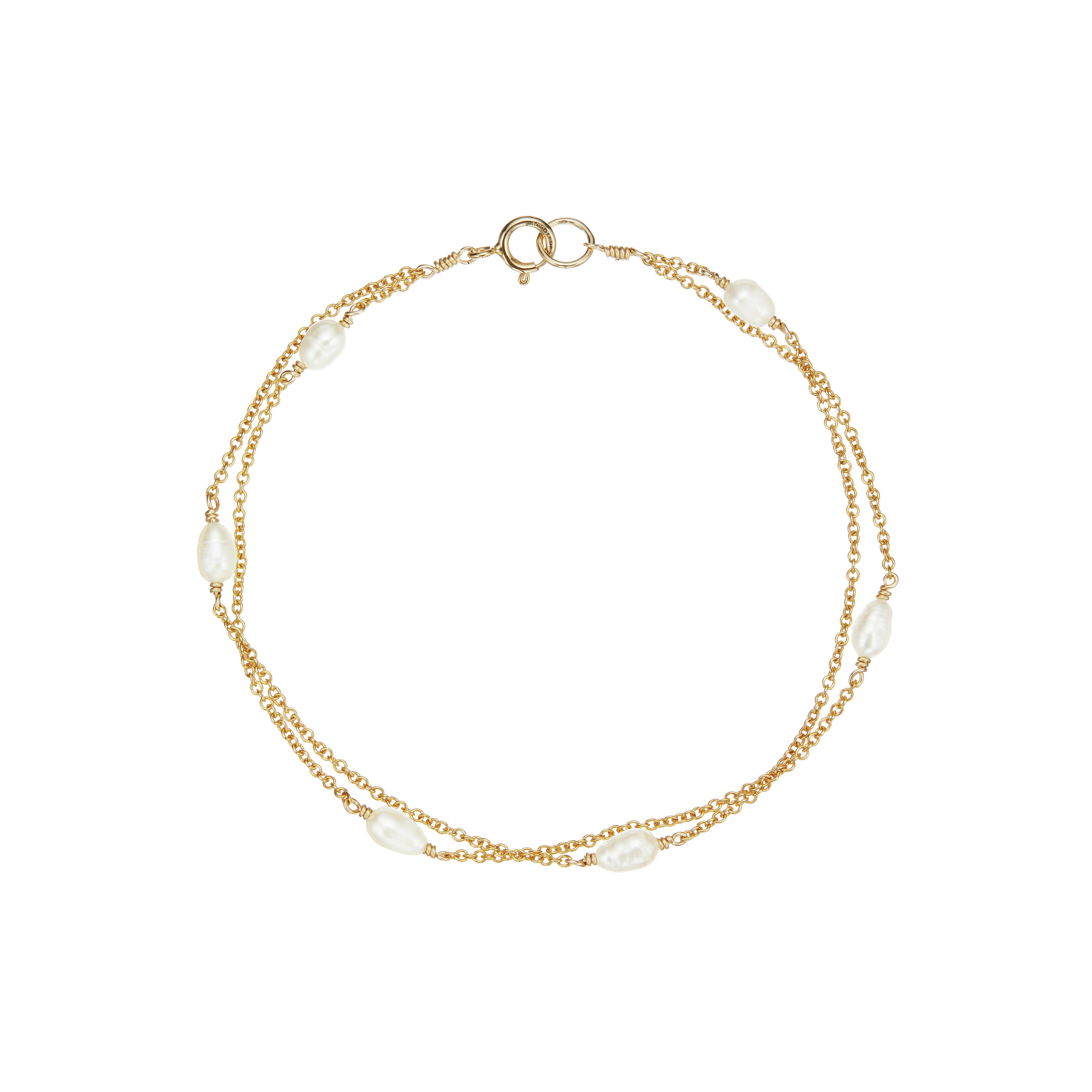 Gold layered seed pearl bracelet on a white background