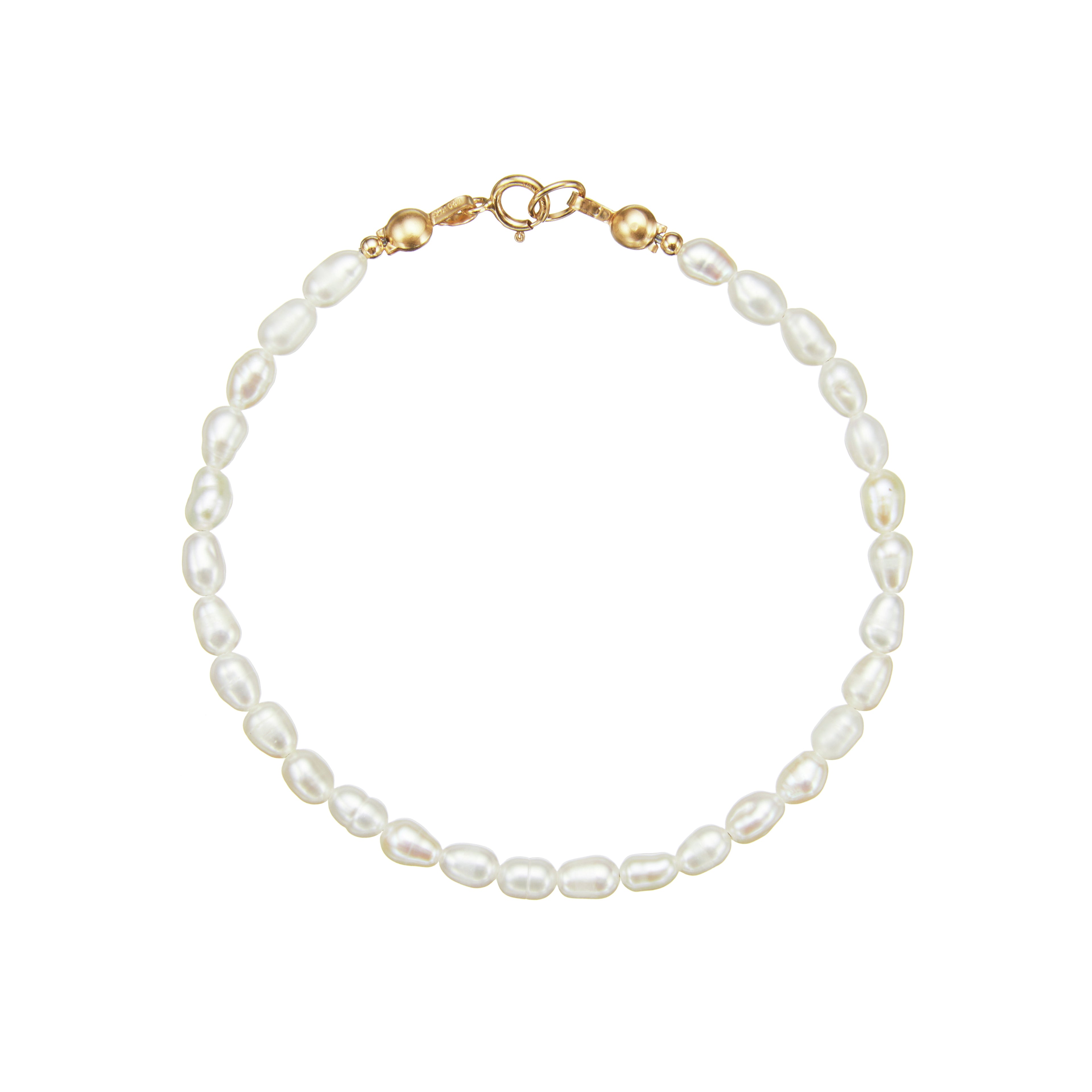 Gold seed pearl bracelet on a white background