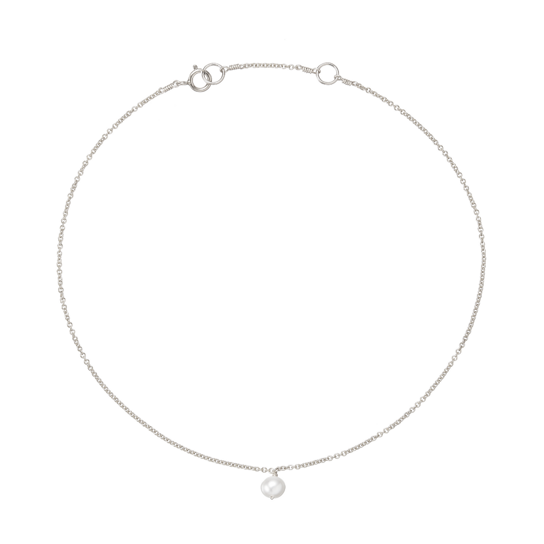 Silver single pearl drop anklet on a white background