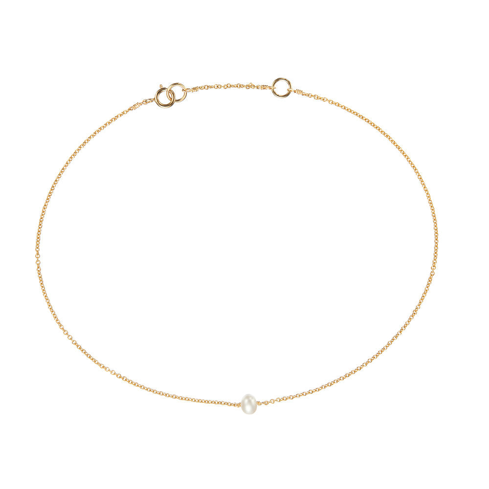Gold small pearl anklet on a white background