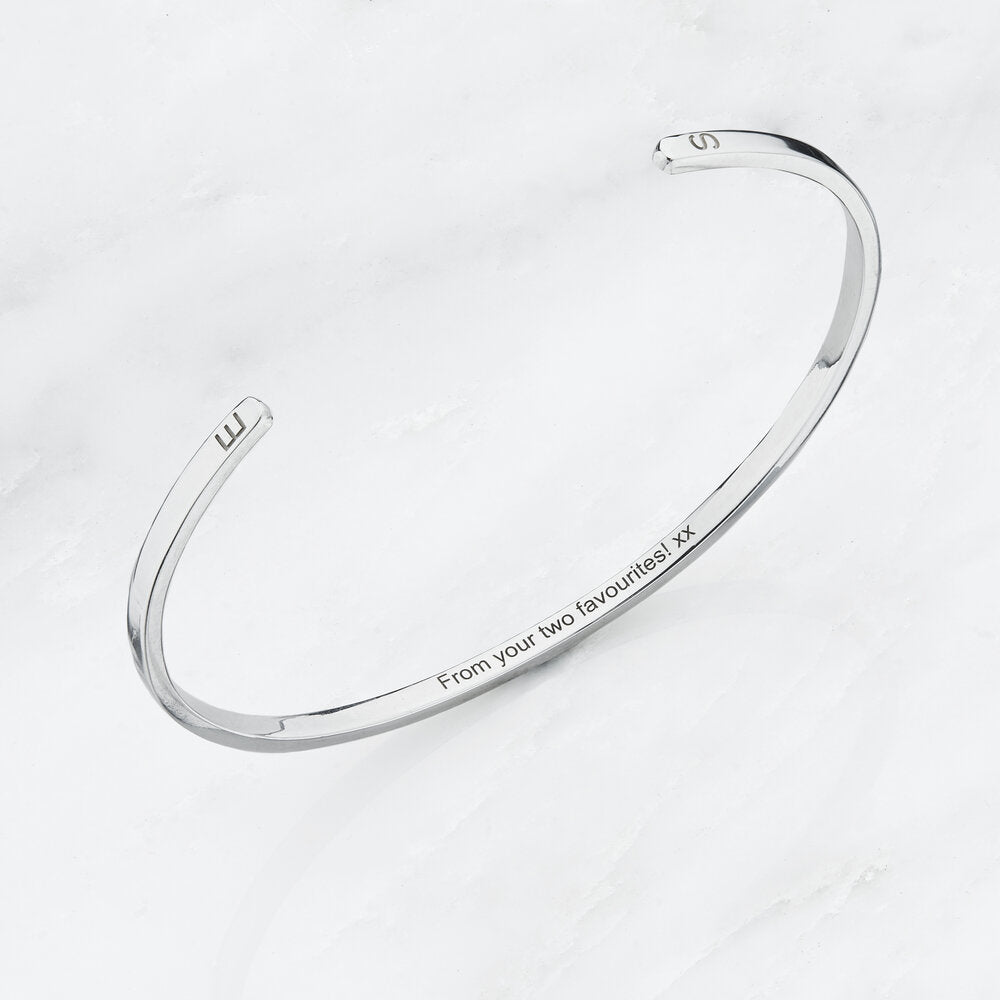 Silver thin engraved bangle with the letters 'B' and 'S' engraved on the outside and 'from your favourites! xx' engraved on the inside