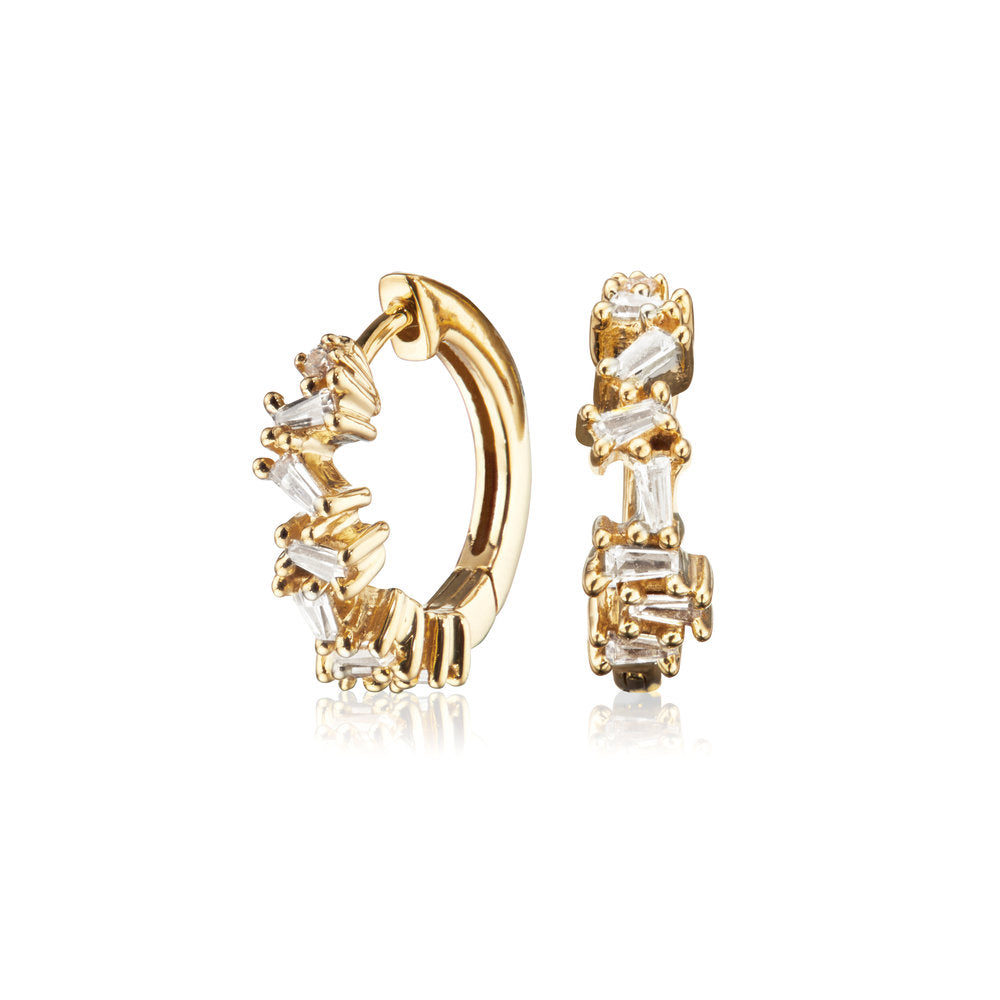 Gold diamond style jagged huggie hoop earrings on a white background