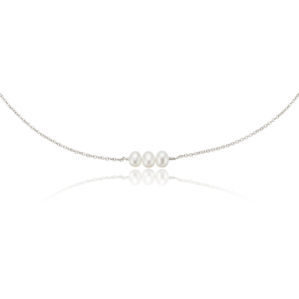 Silver cluster pearl choker on a white background