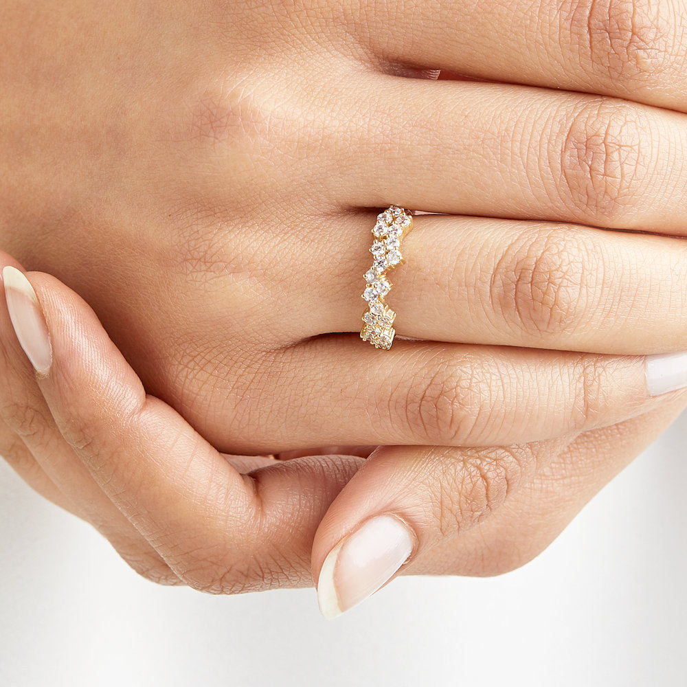 Silver diamond style cluster ring on a finger