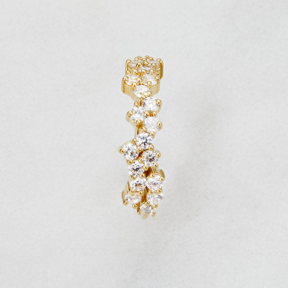 Birds-eye-view of a diamond style cluster ring on a marble surface
