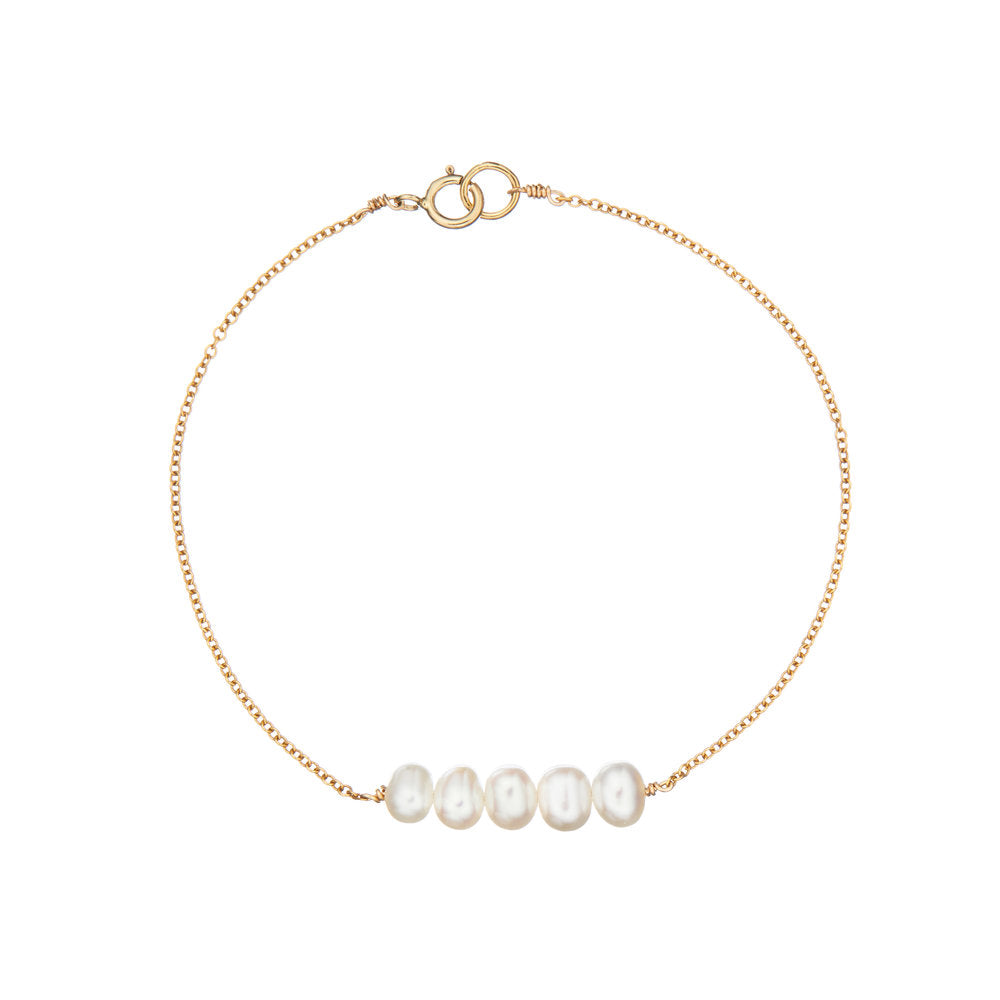 Gold cluster pearl bracelet on a white background