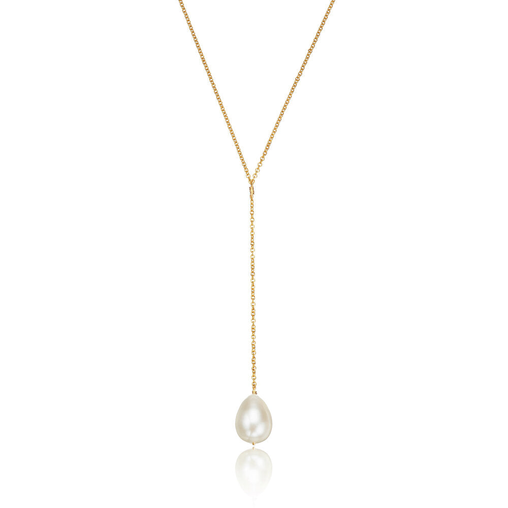 Gold large pearl lariat necklace on a white background