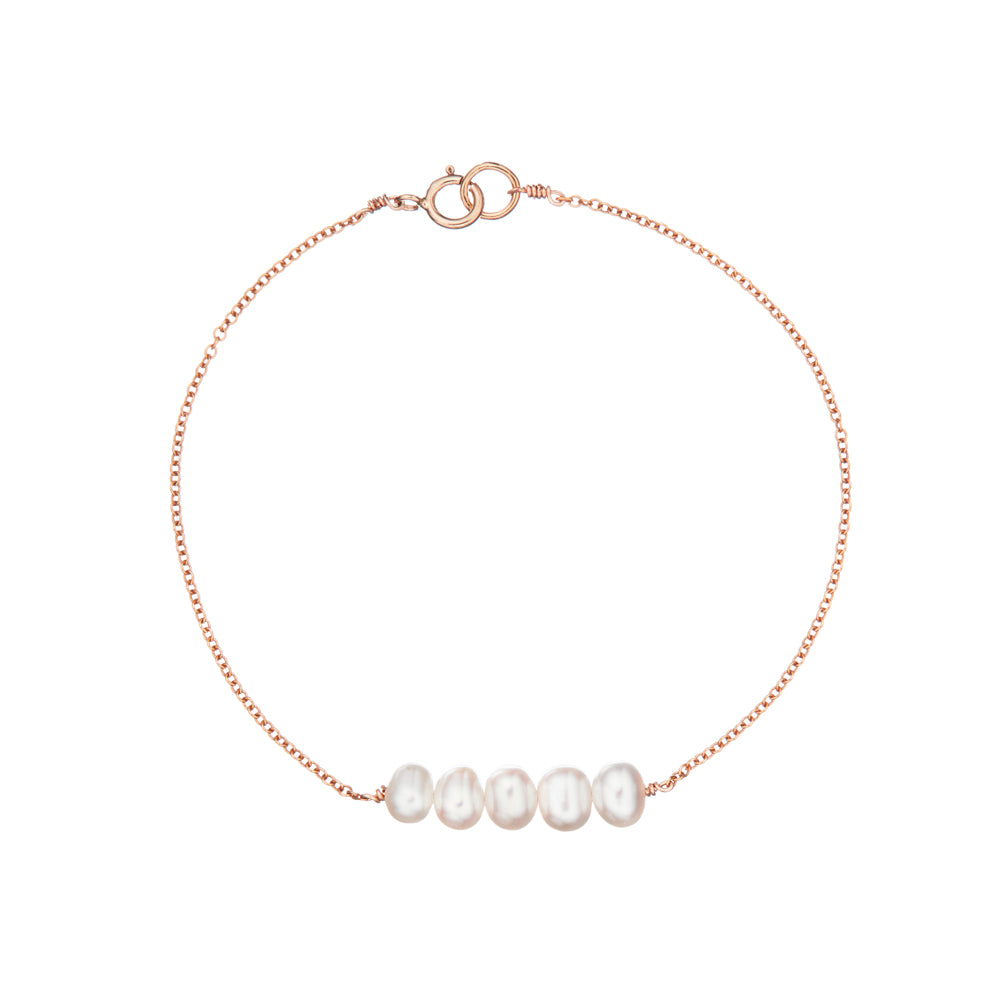 Rose gold cluster pearl bracelet on a white background