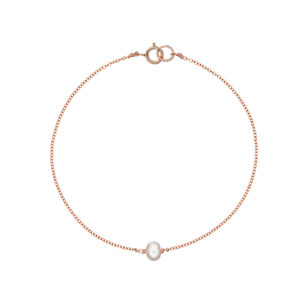 Rose gold single pearl bracelet on a white background