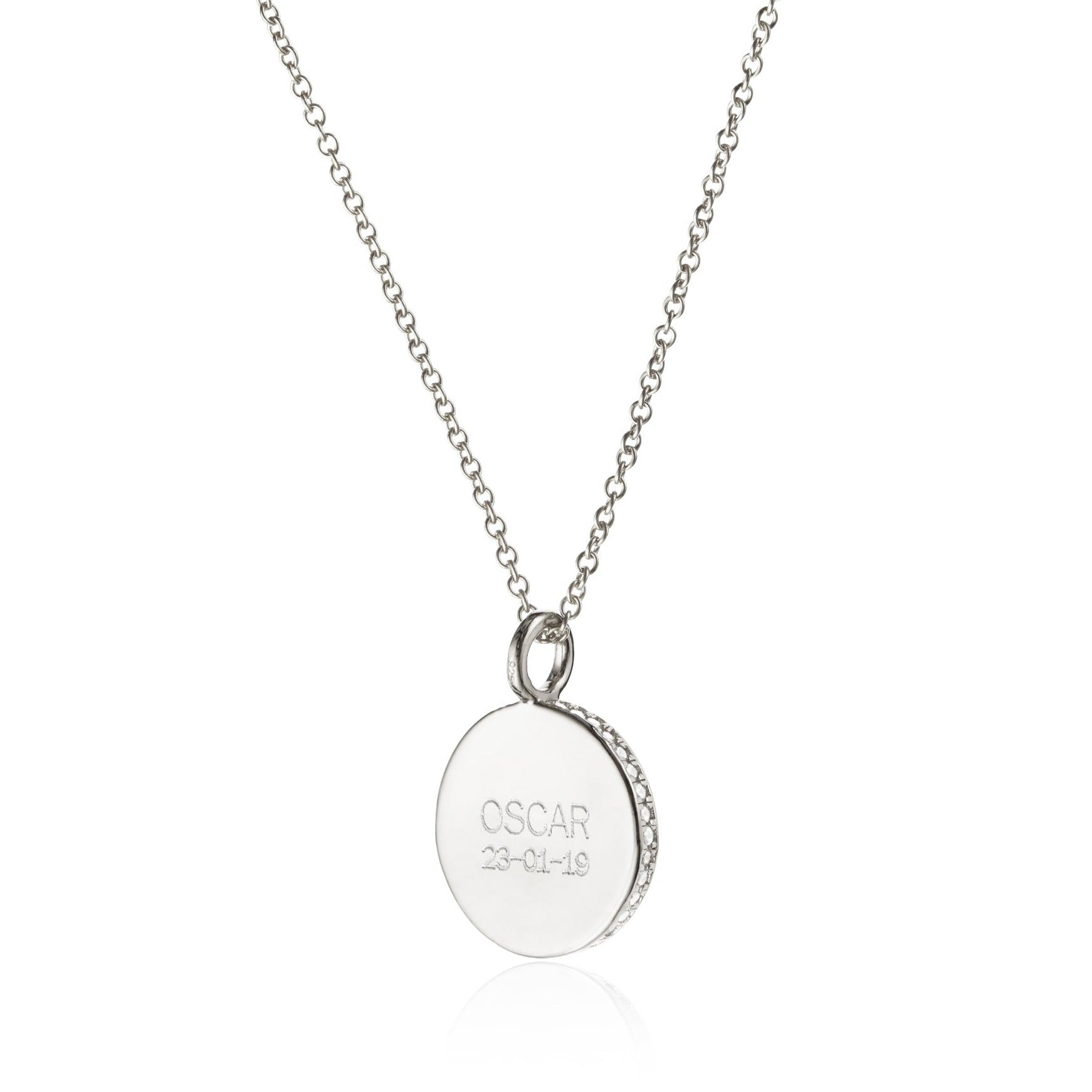 Silver small diamond style disc necklace with the name OSCAR engraved on a white background