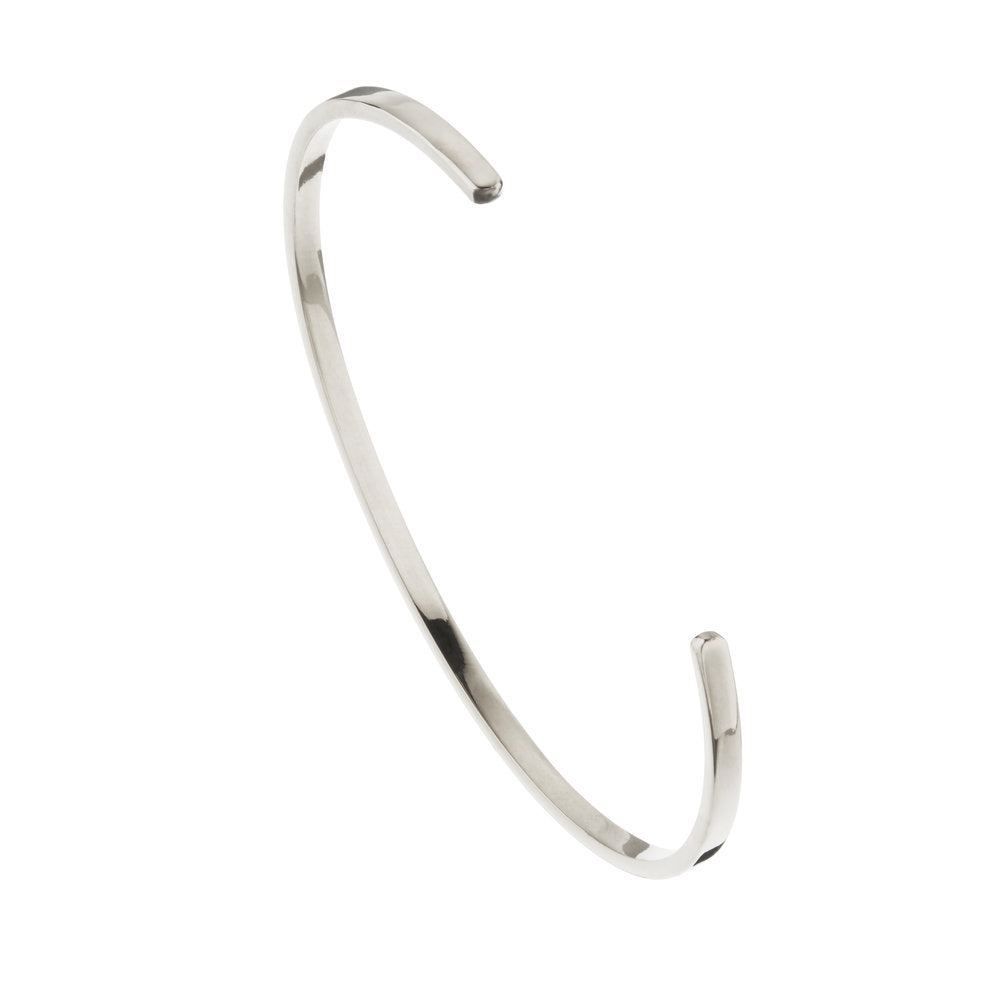 Silver thin engraved bangle on a white background