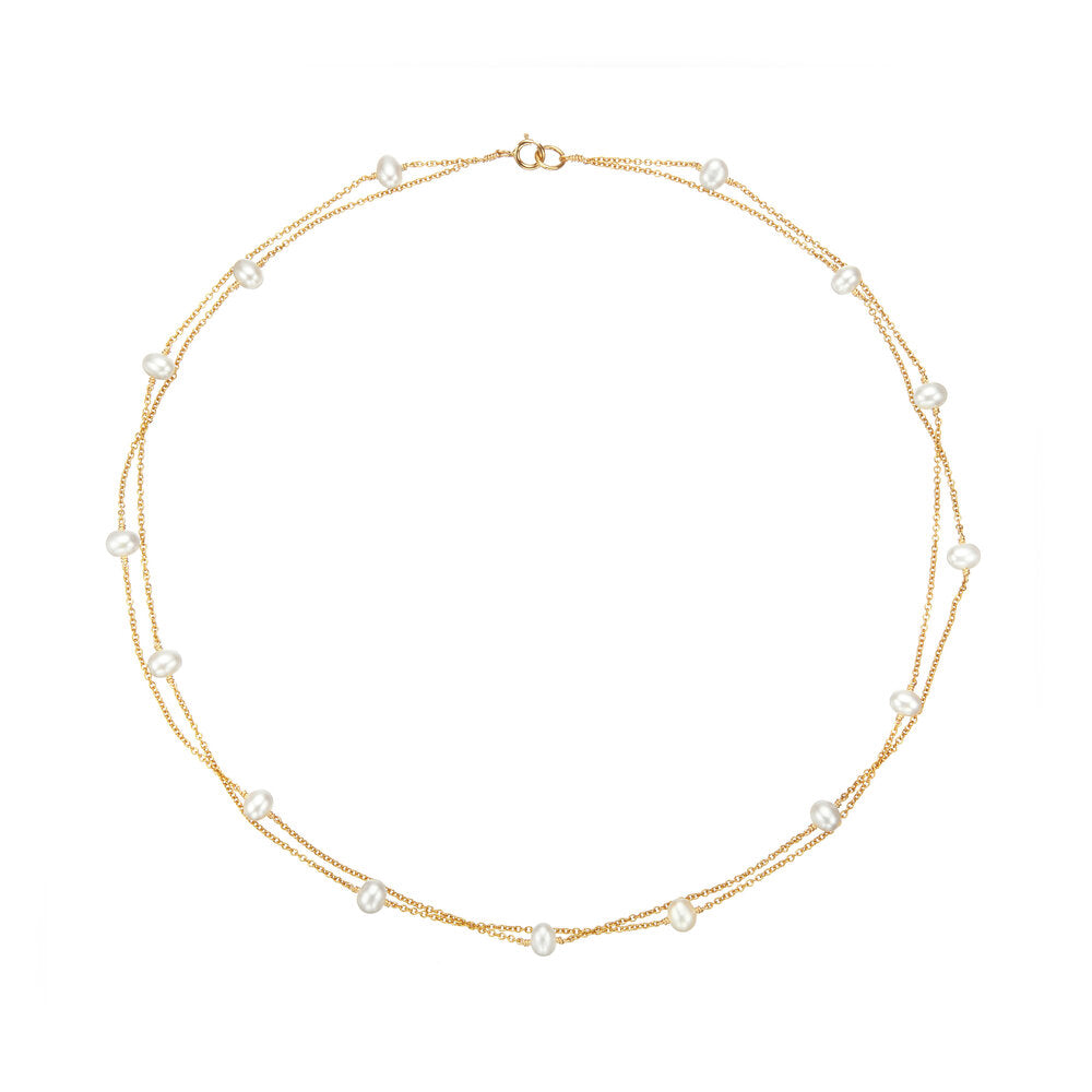 Gold layered pearl necklace on a white background