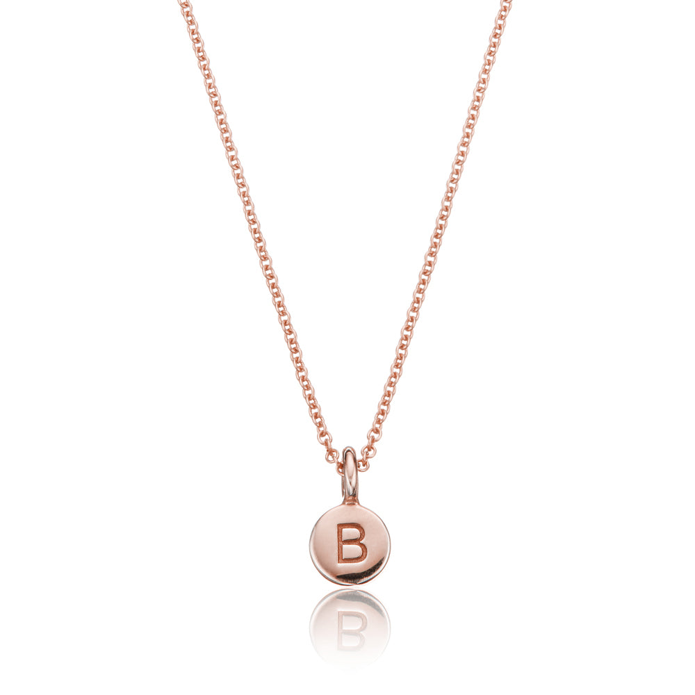 Rose gold extra small personalised disc necklace with the letter 'B' engraved on it, on a white background