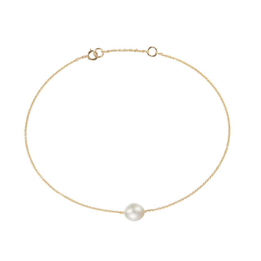 Gold large pearl anklet on a white background