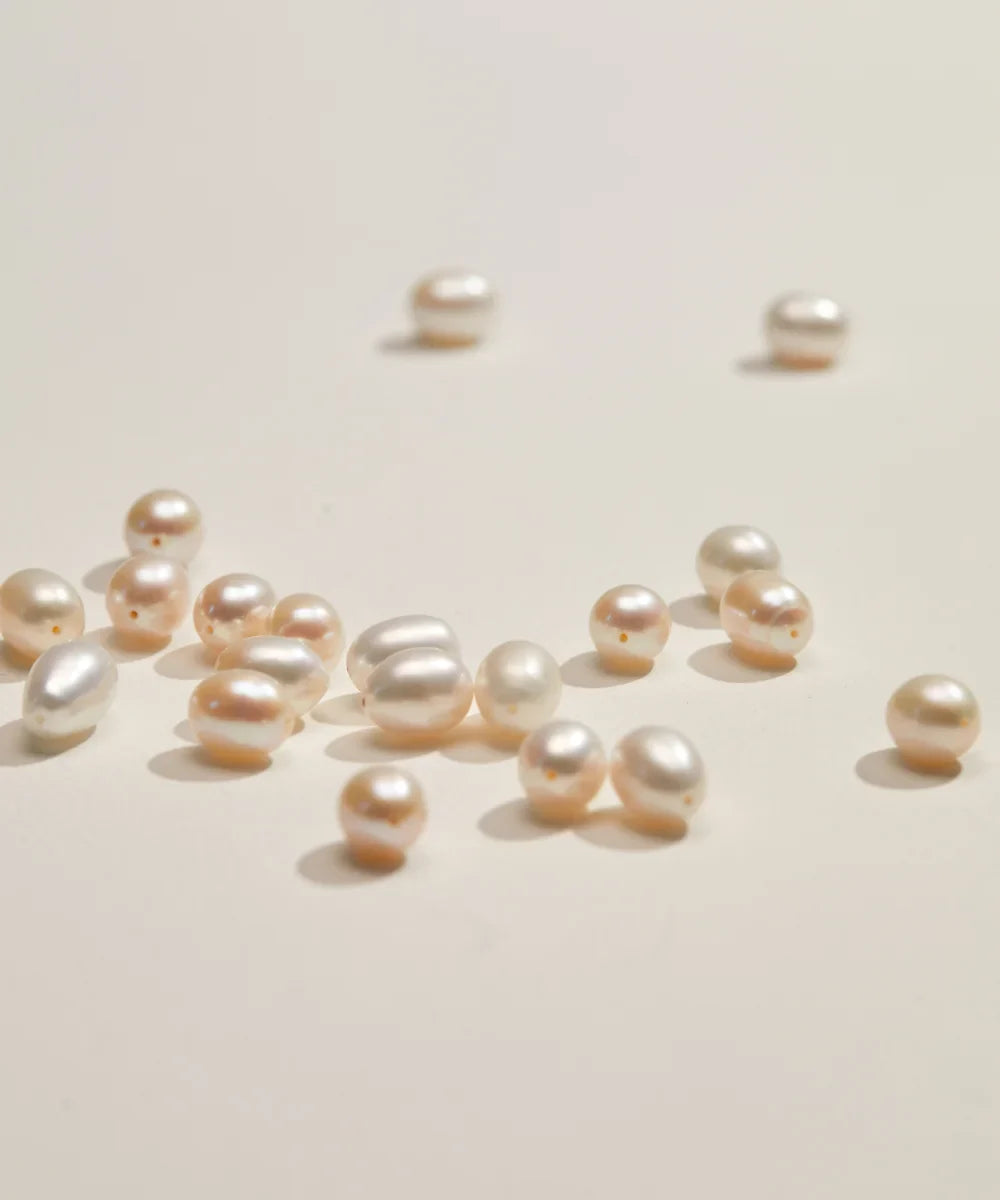 Freshwater pearls in a variety of natural shapes and soft ivory tones, hand-selected for LILY & ROO jewellery.