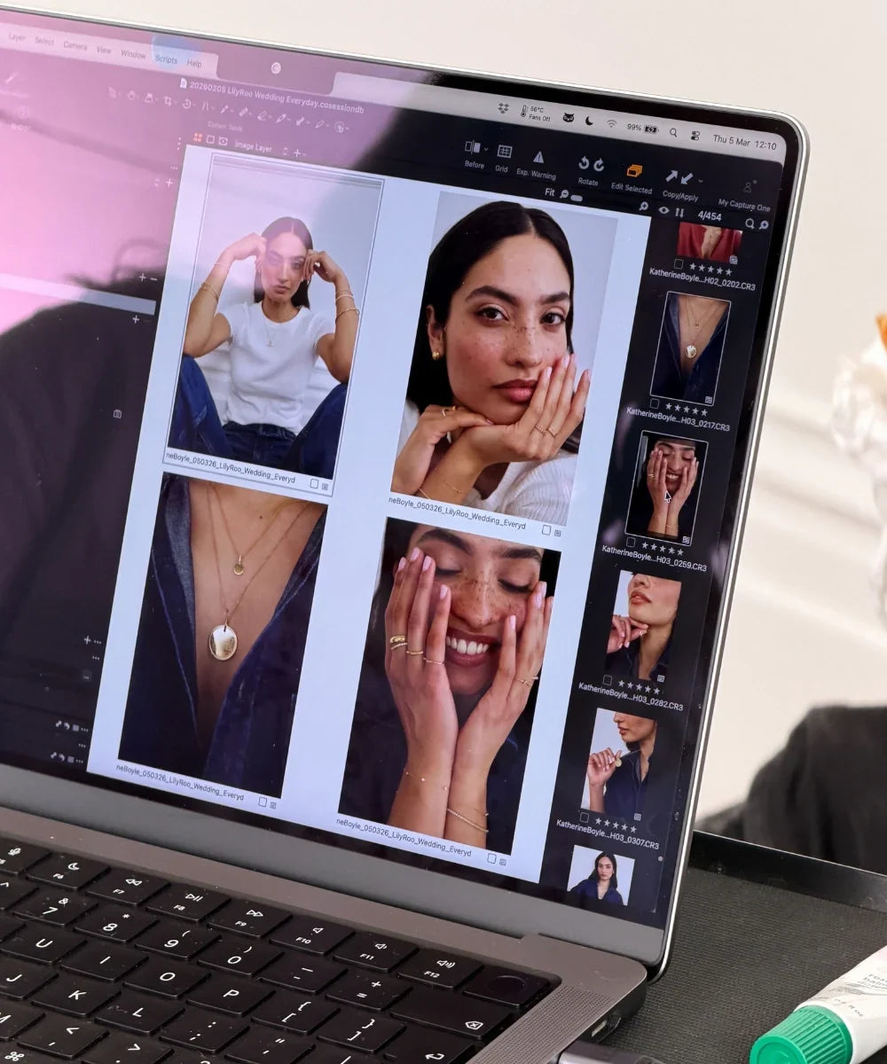 Behind-the-scenes view of LILY & ROO jewellery collection photography displayed on a laptop screen, featuring models wearing necklaces, earrings, bracelets and rings.