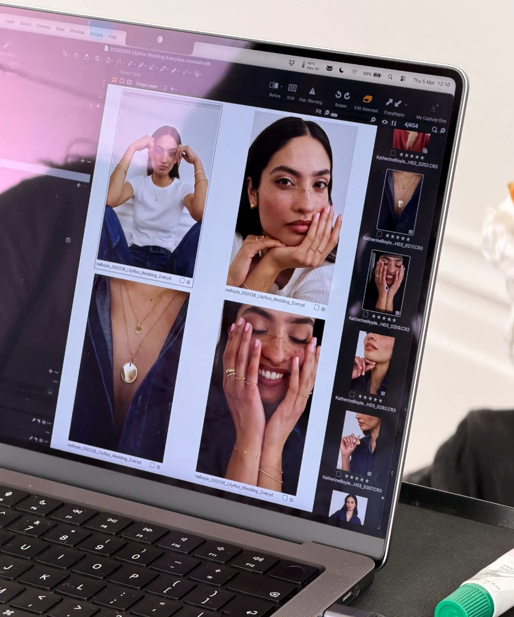 Behind-the-scenes view of LILY & ROO jewellery collection photography displayed on a laptop screen, featuring models wearing necklaces, earrings, bracelets and rings.
