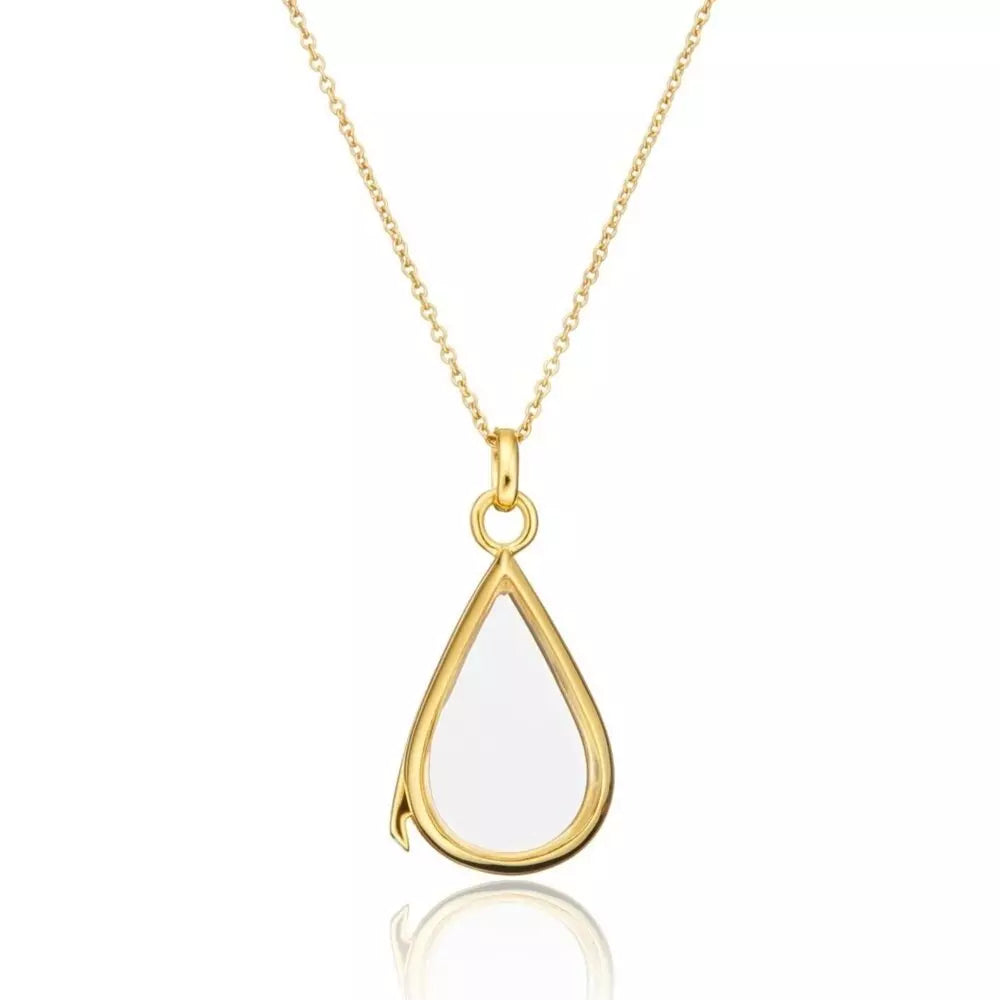 Gold glass gemstone teardrop locket on a white background
