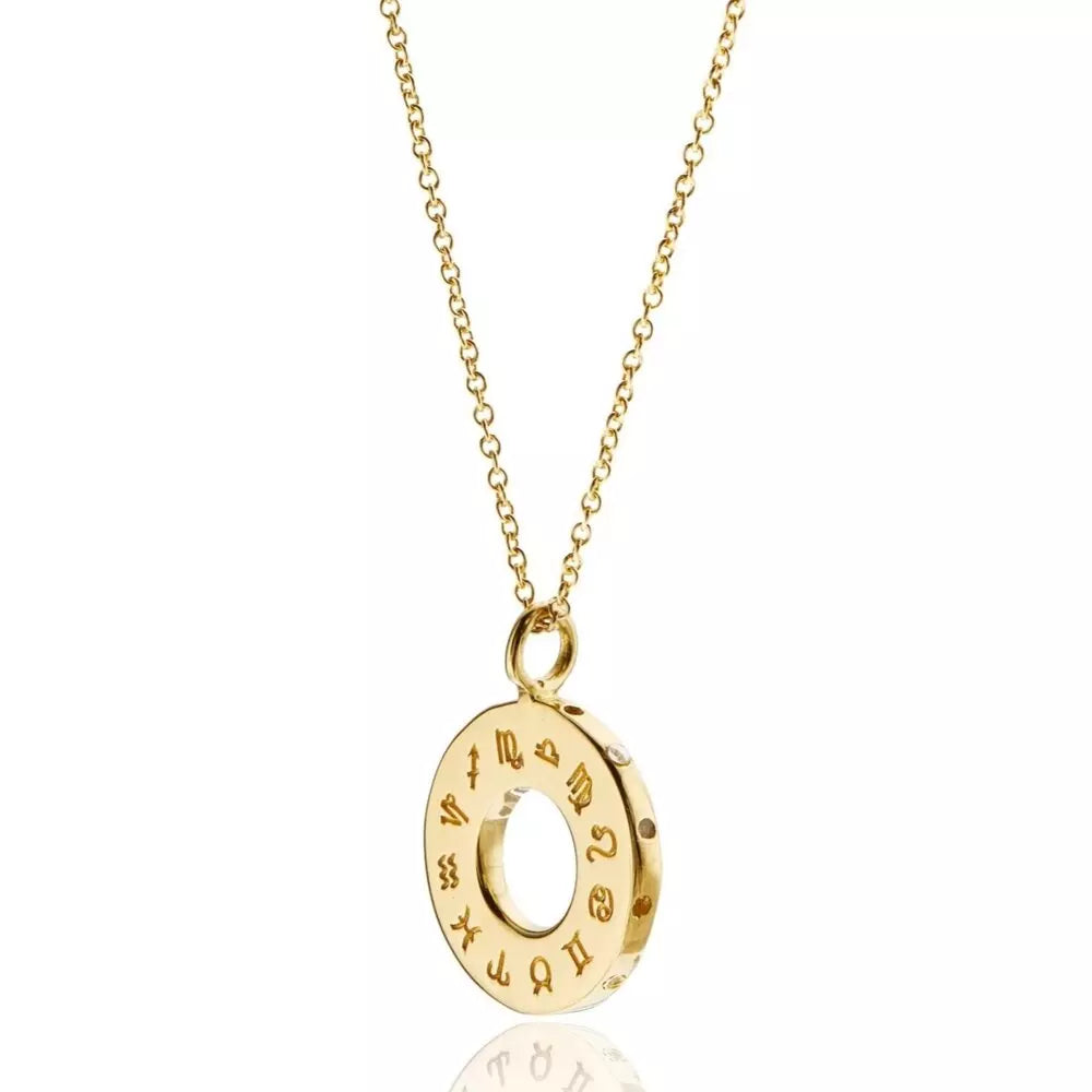 Gold zodiac birthstone necklace on a white background