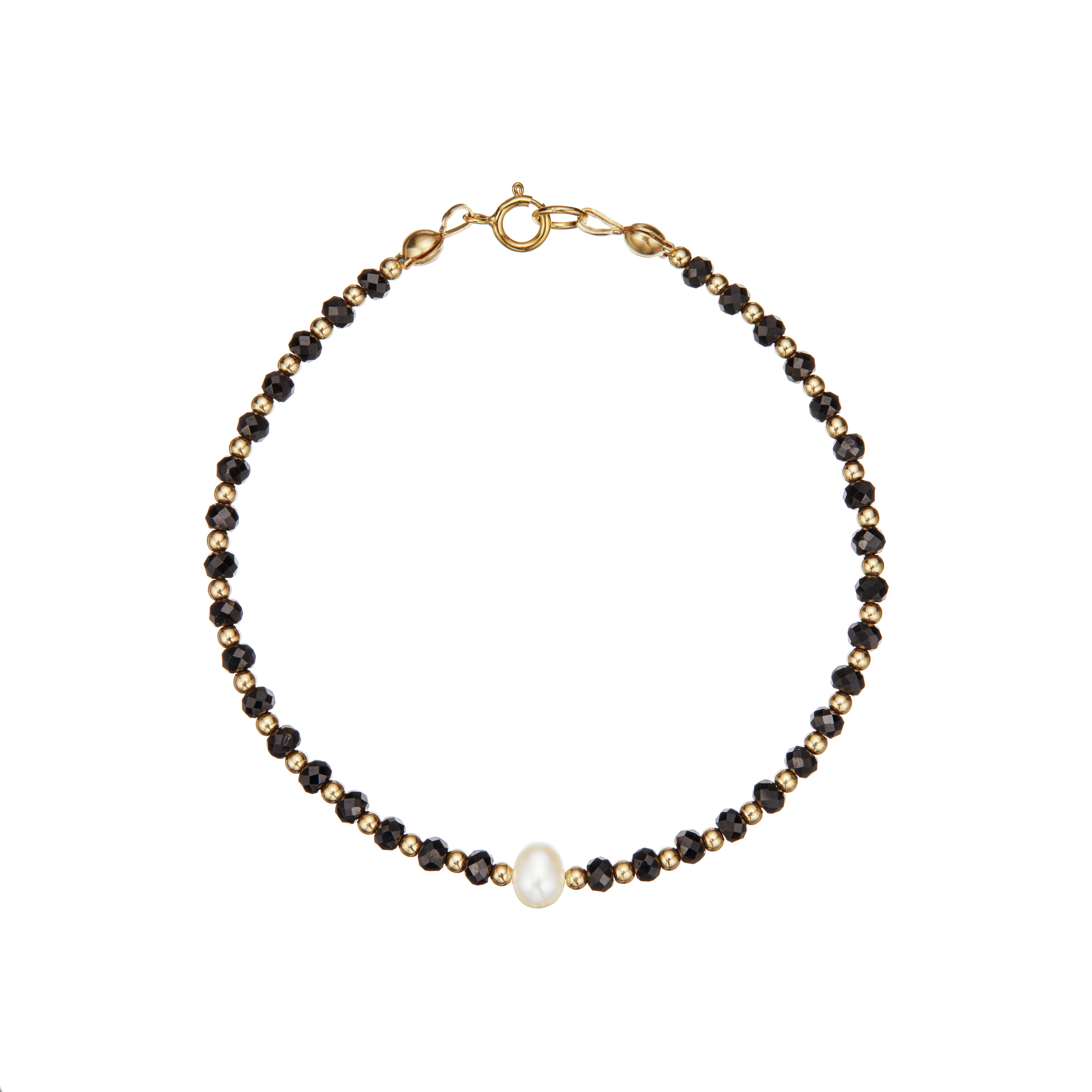 Gold spinel gemstone bracelet on a white background