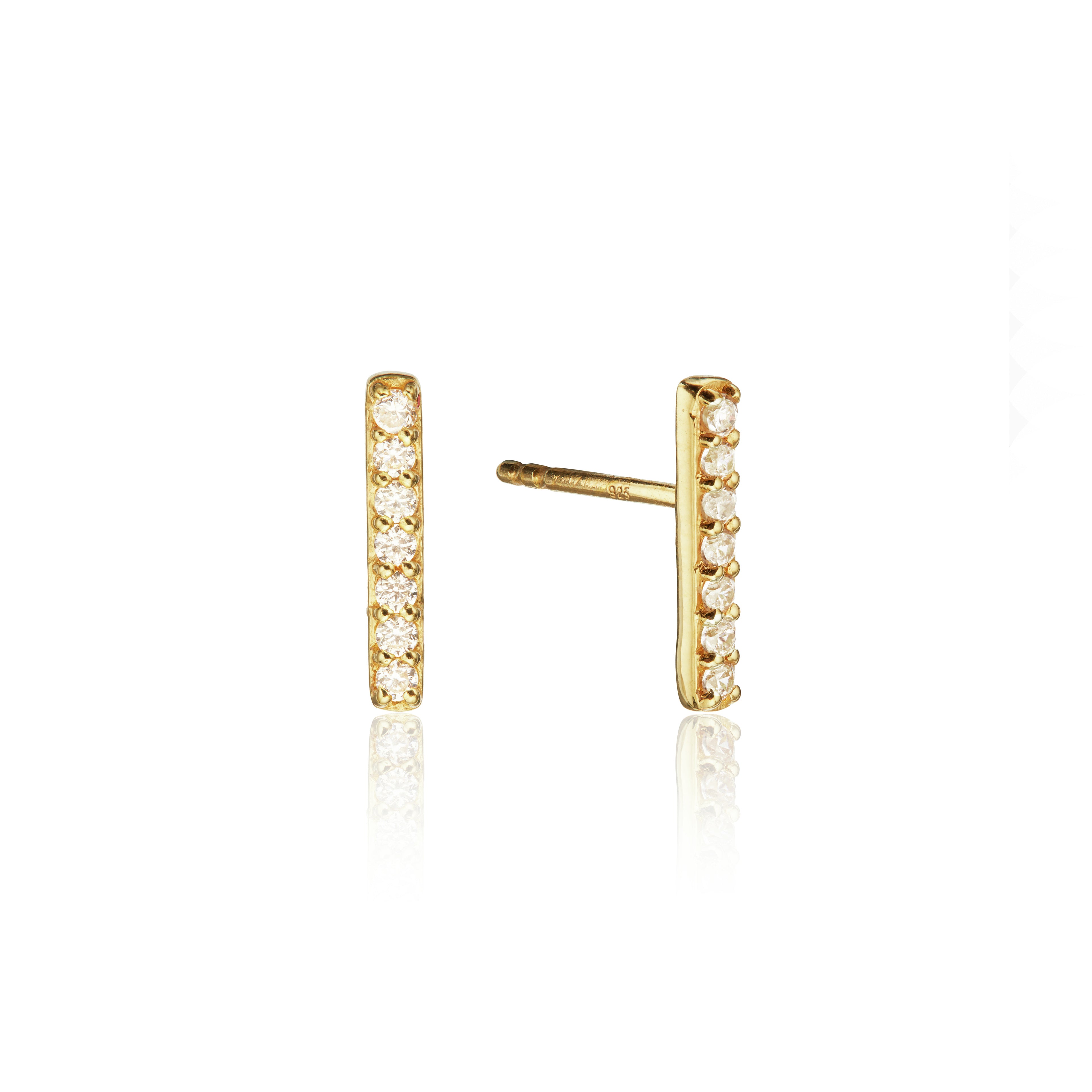 Gold diamond style bar stud earrings on a white background