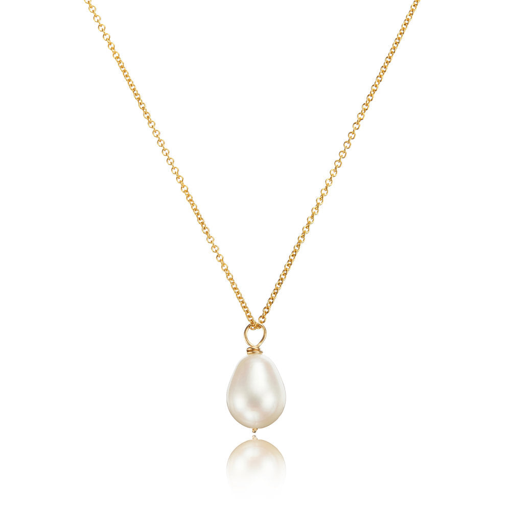 Gold large single pearl necklace on a white background