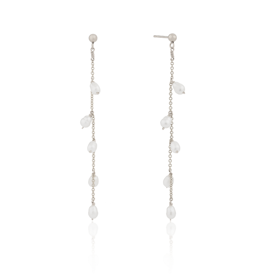 Silver seed pearl drop earrings on a white background