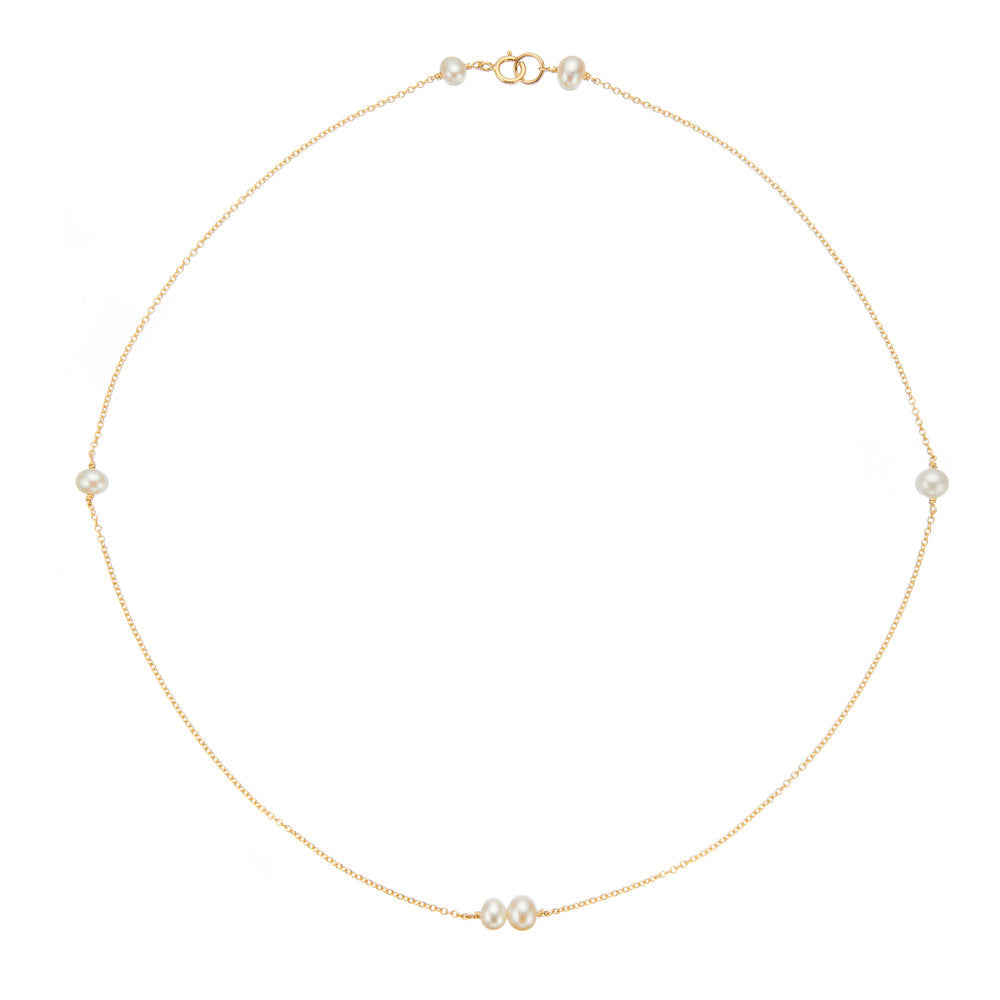 Gold six pearl choker necklace on a white background