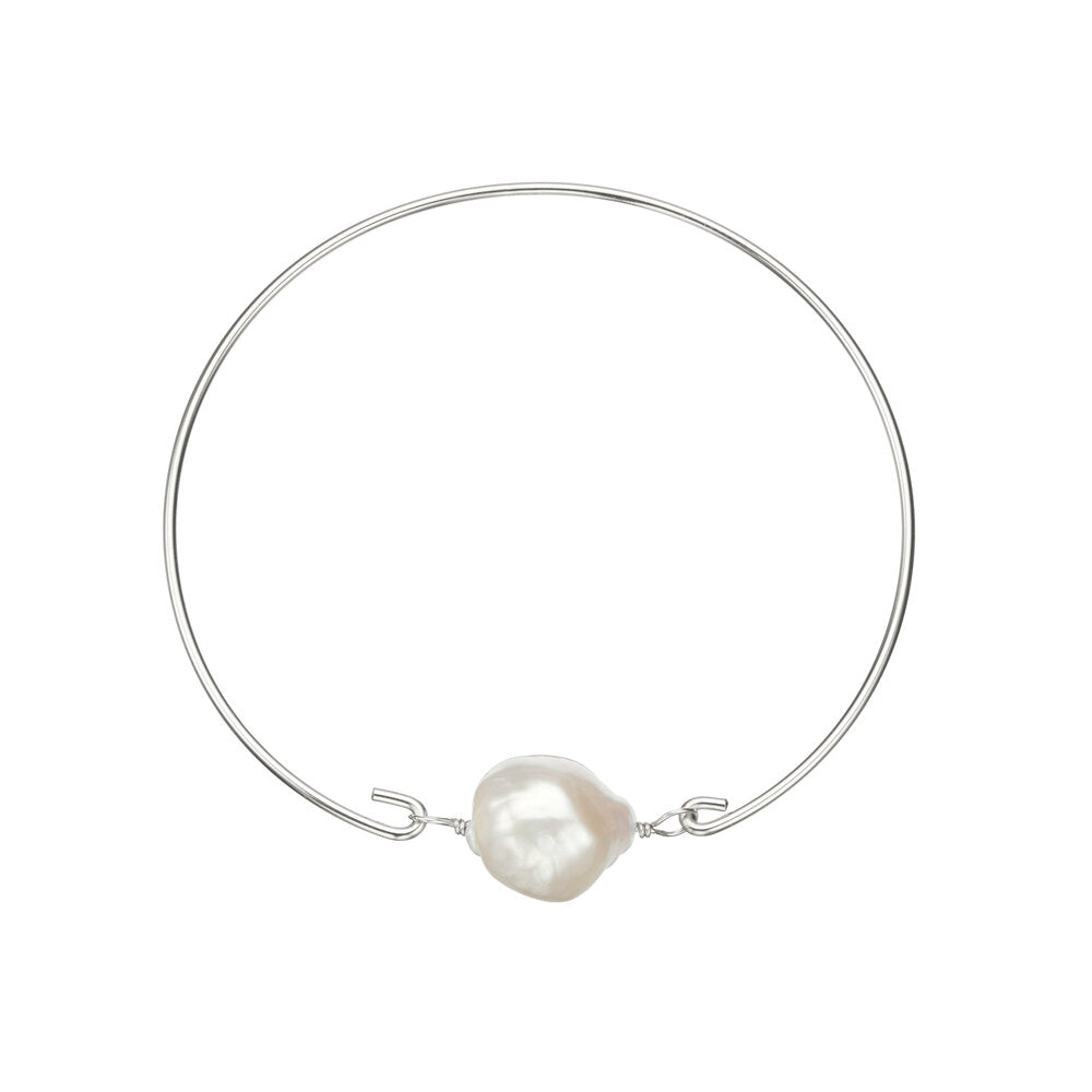 Silver baroque pearl bangle on a white background