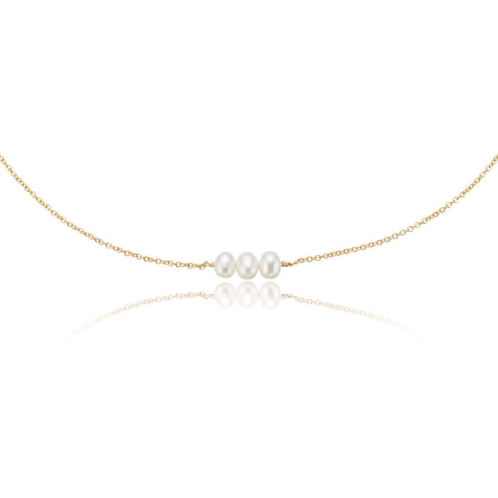 Gold cluster pearl choker on a white background 