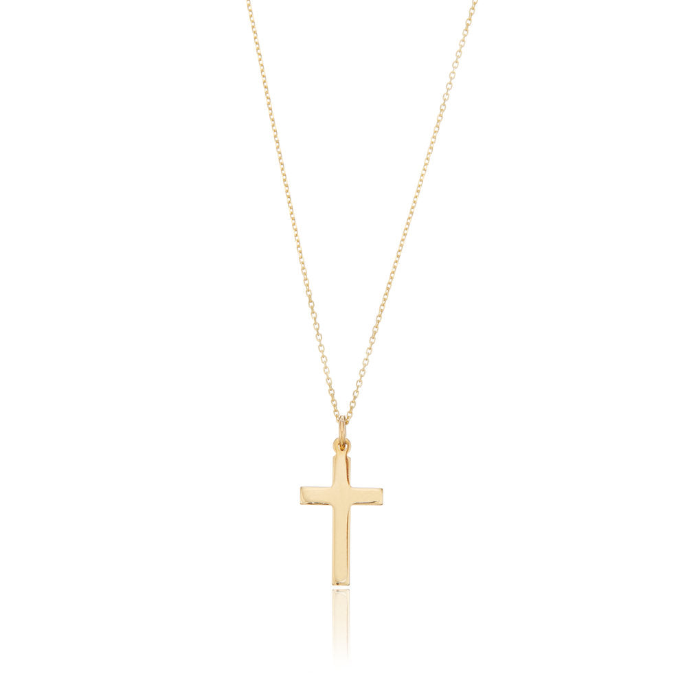 Solid gold cross necklace on a white background