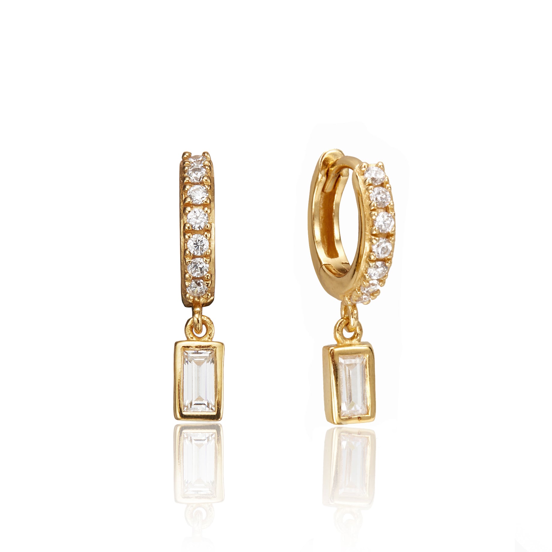 Gold diamond style baguette drop huggie hoop earrings on a white background
