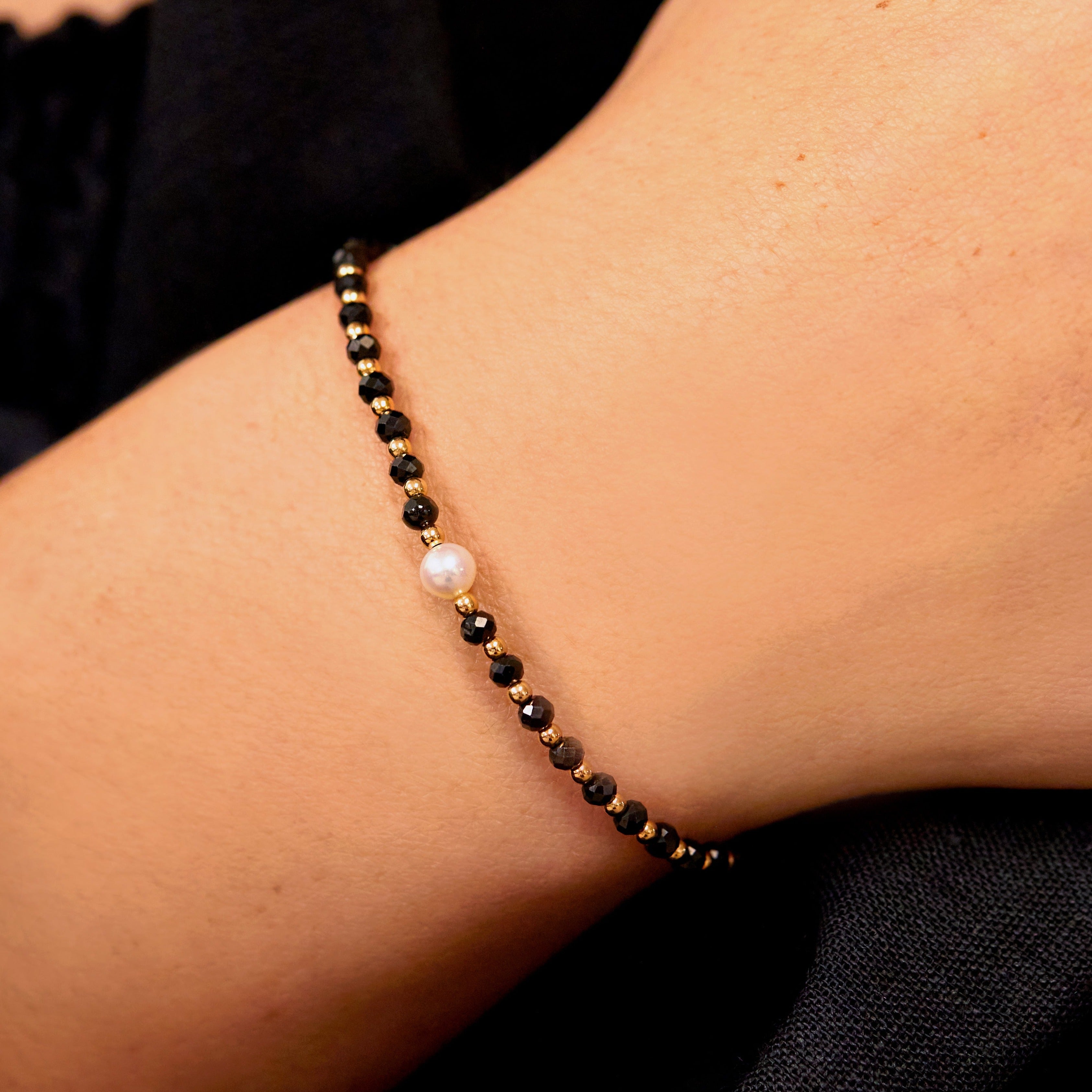 Gold spinel gemstone bracelet close up on a wrist