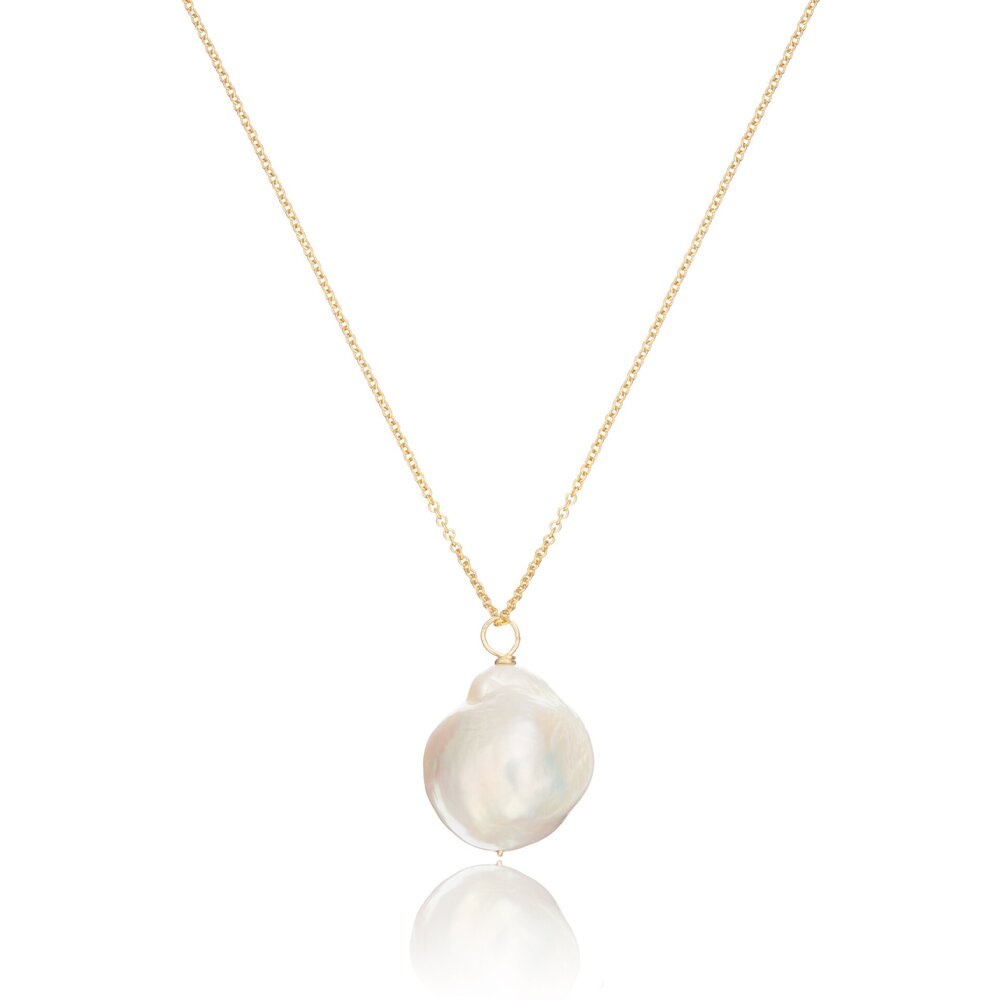 Gold extra large baroque pearl necklace on a white background