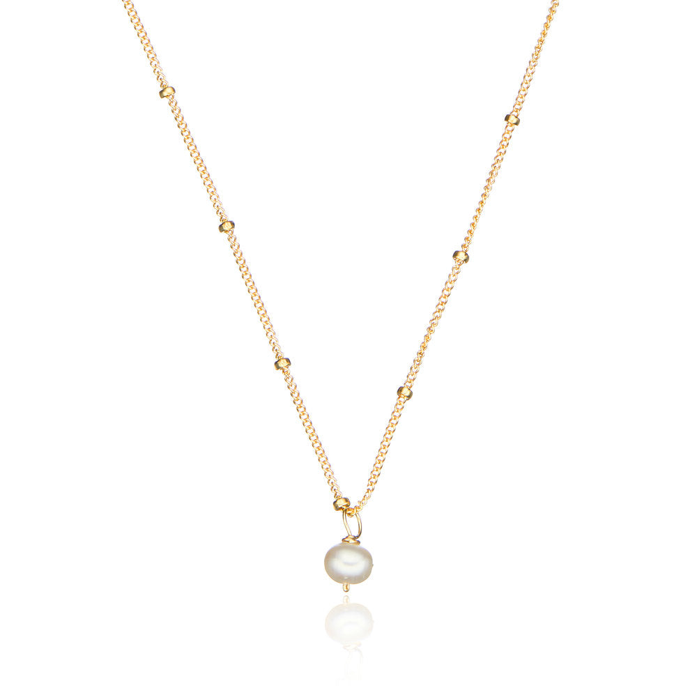 Gold single pearl satellite necklace on a white background