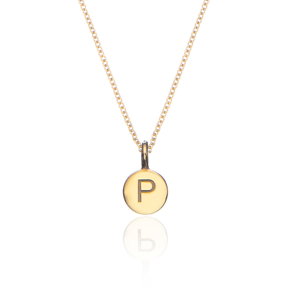 Gold small personalised disc necklace with the letter 'P' engraved on a white background