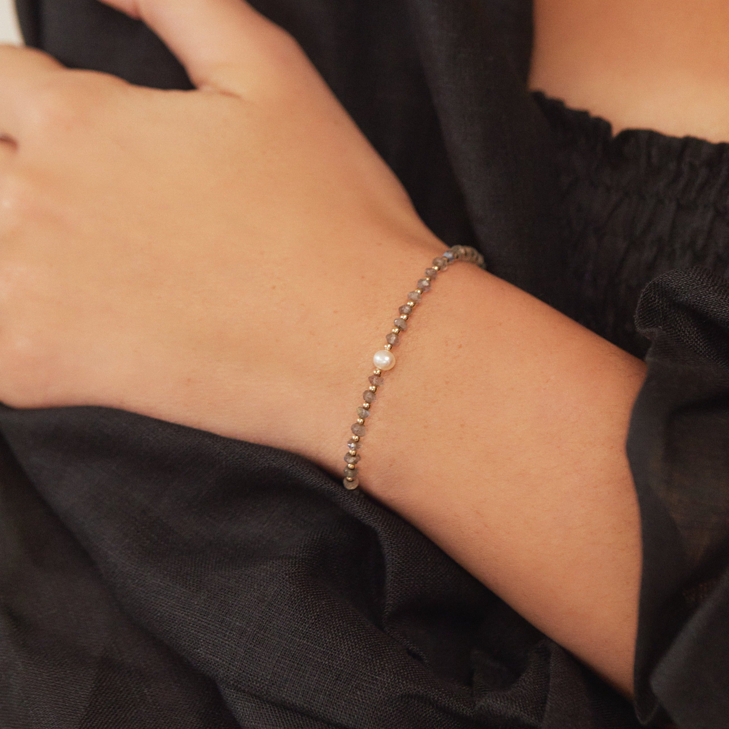 Gold labradorite gemstone bracelet on a wrist