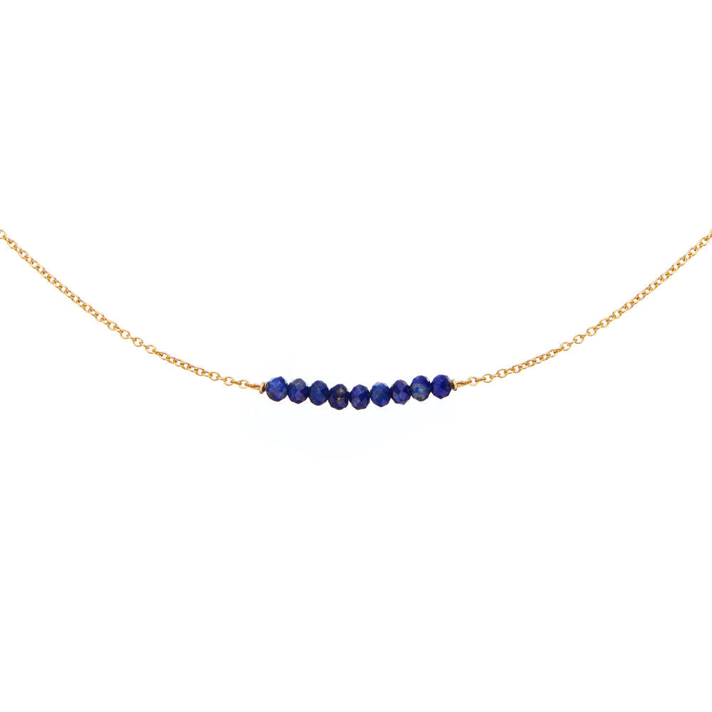 Gold lapis gemstone cluster choker on a white background