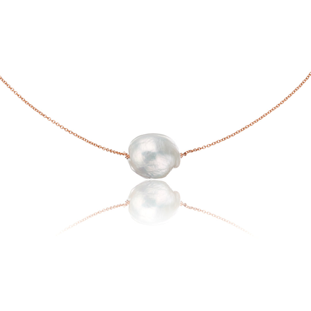 Rose gold large baroque pearl choker on a white background