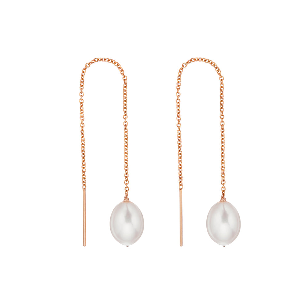 Rose gold large pearl drop ear threaders on a white background