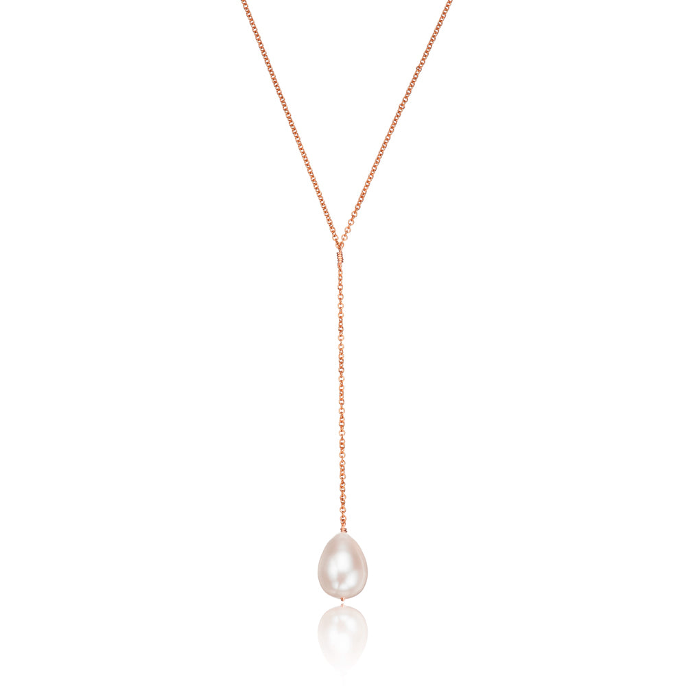 Rose gold large pearl lariat necklace on a white background