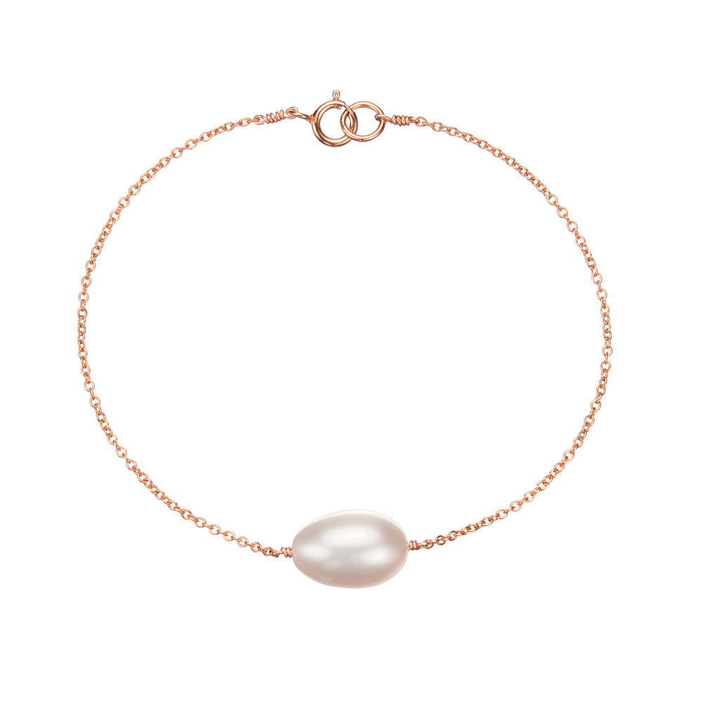 Rose gold large pearl bracelet on a white background
