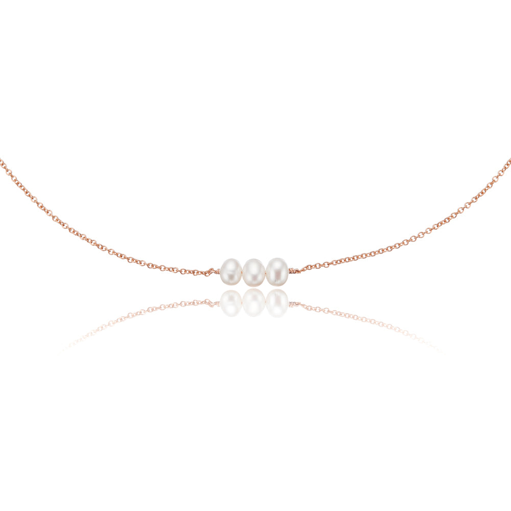 Rose gold cluster pearl choker on a white background