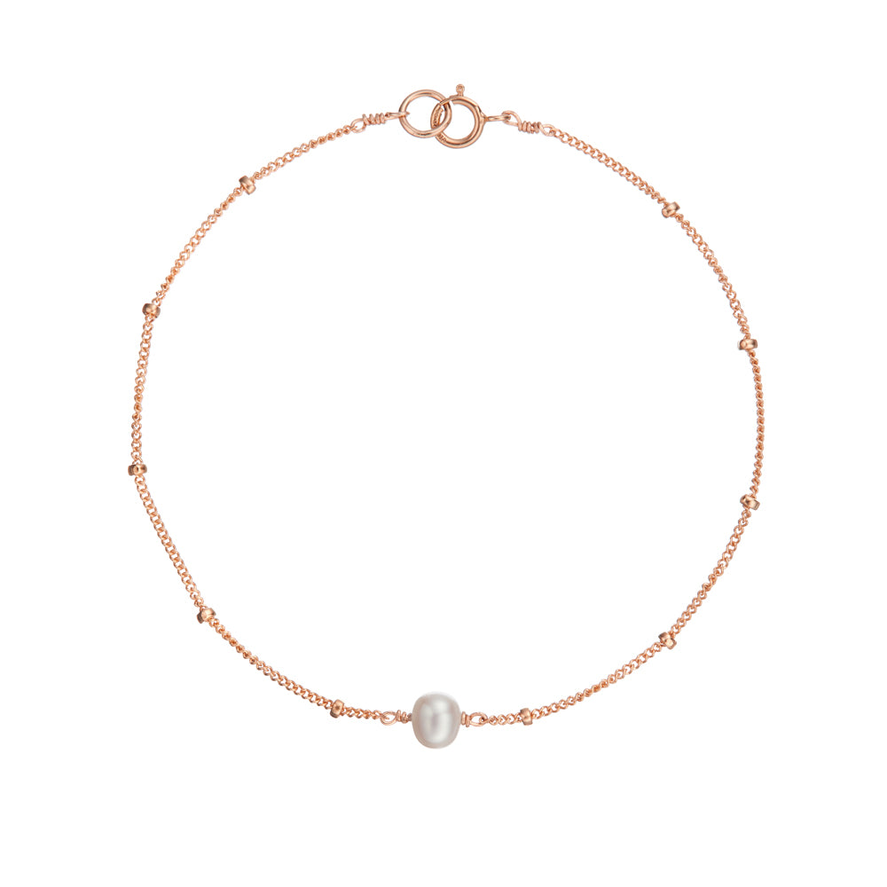 Rose gold satellite pearl bracelet on a white background