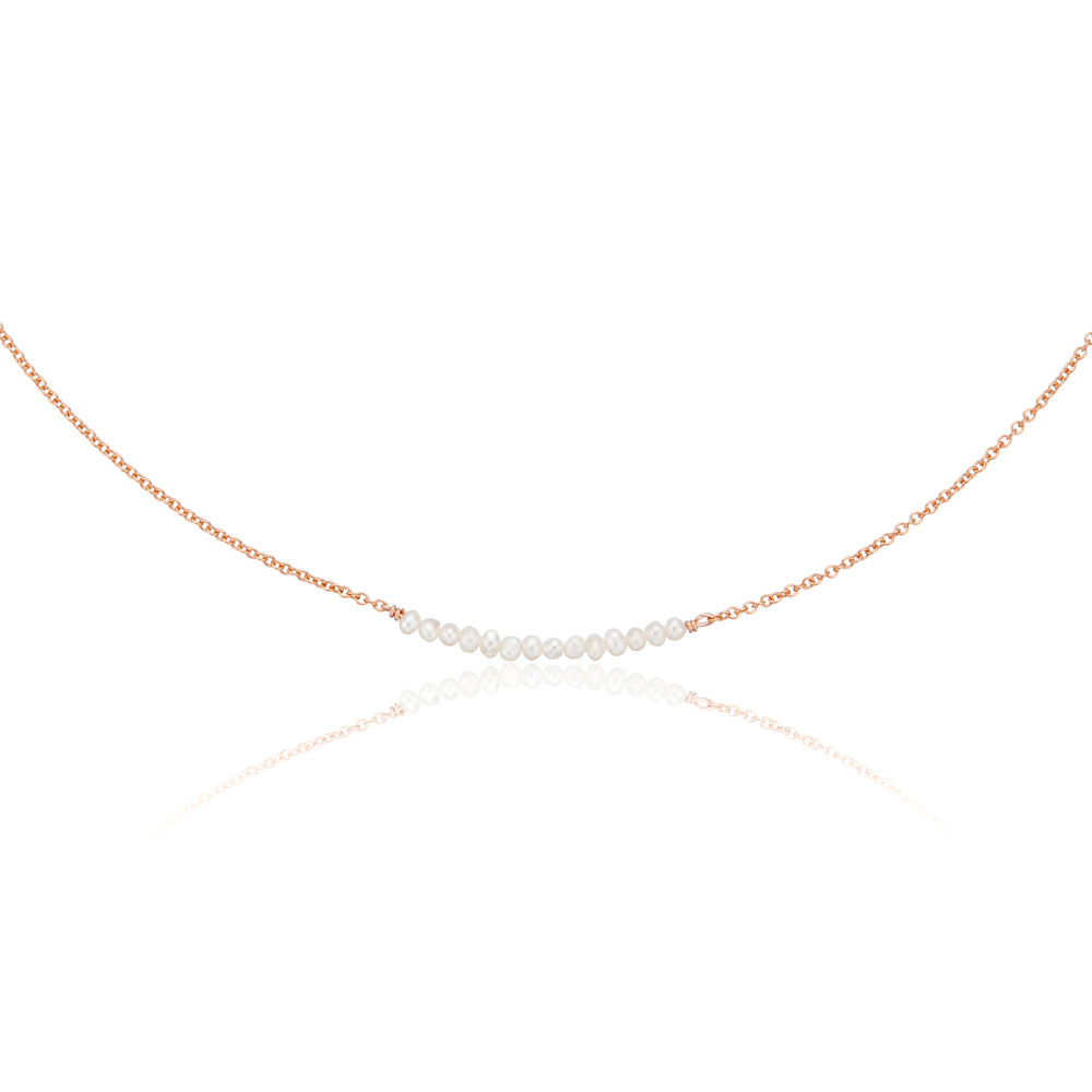 Rose gold small pearl cluster choker on a white background