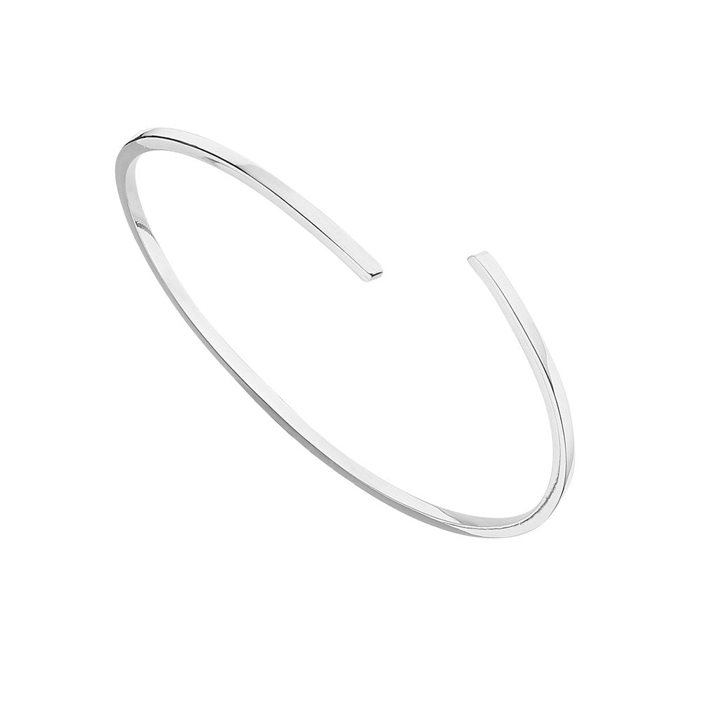 Silver thin spiral bangle on a white background