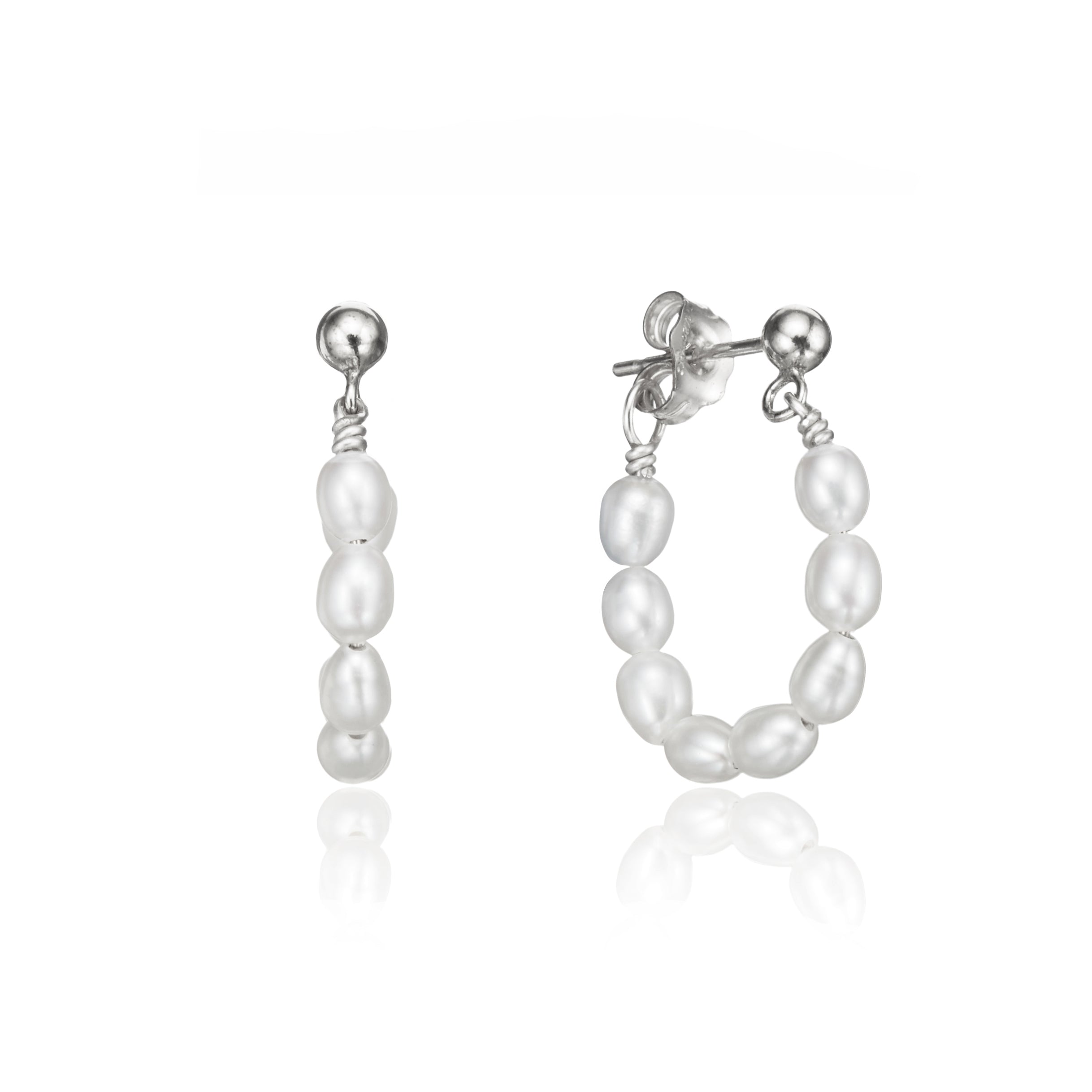 Silver seed pearl hoop earrings on a white background